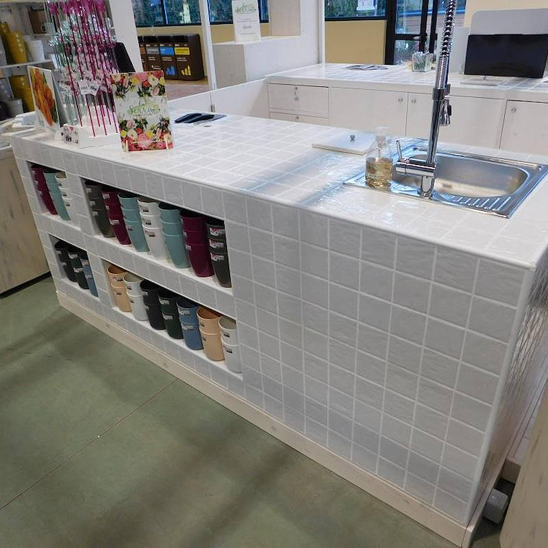 Wood work table covered in ceramics